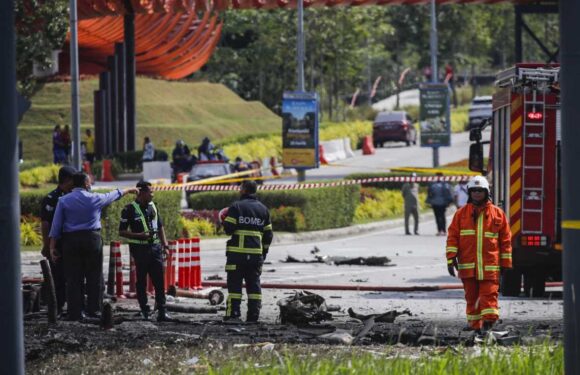 At least ten killed as private jet crashes in flames on a car and motorbike on busy highway in Malaysia | The Sun