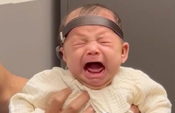 Baby bursts into floods of tears after hearing dad’s voice for first time