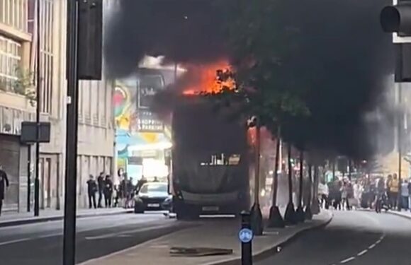 Bus inferno has black smoke billowing into sky as emergency services descend