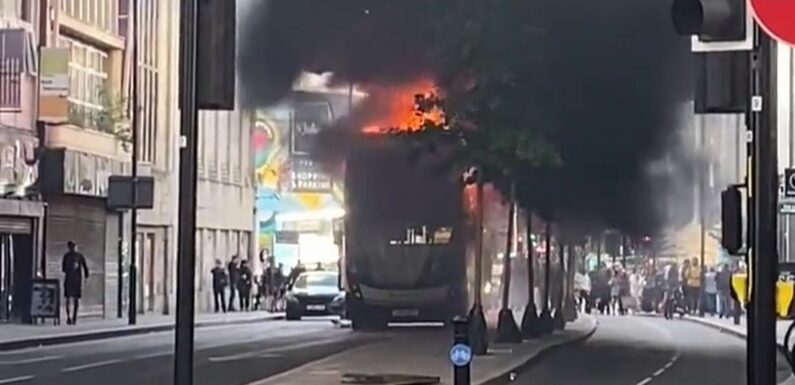 Bus inferno has black smoke billowing into sky as emergency services descend