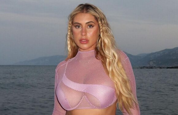 Curvy model risks wardrobe malfunction as she flaunts curves in cut-out bikini