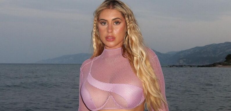 Curvy model risks wardrobe malfunction as she flaunts curves in cut-out bikini