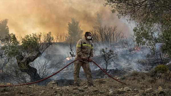 Firefighters battle to tackle wildfires raging across Greece and Spain