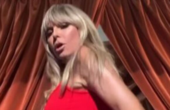 Heidi Klum flashes bum cheek in very busty red dress as she performs sexy dance