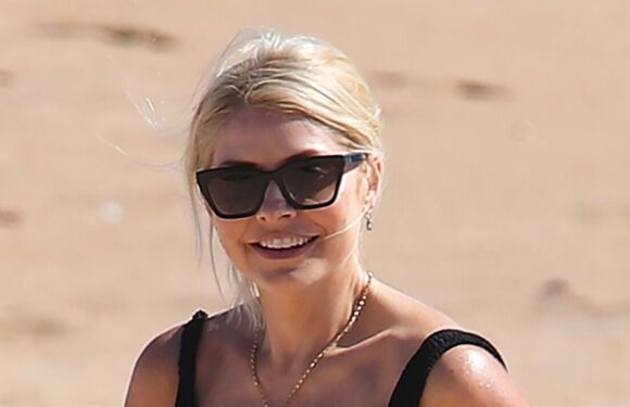 Holly Willoughby looks better than ever in plunging black swimsuit