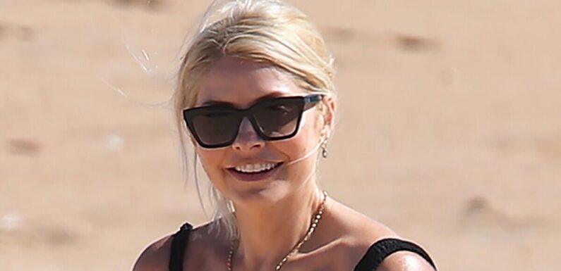 Holly Willoughby looks better than ever in plunging black swimsuit