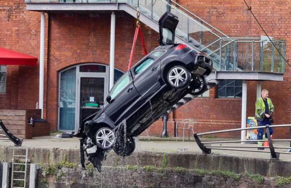 Horror as man dies after car smashes through barriers and drives into water at Swansea marina | The Sun