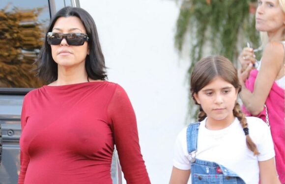 Kourtney Kardashian flaunts baby bump in skintight red dress on day out with daughter Penelope