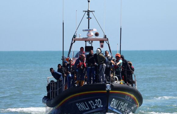 Lifeboat lands migrants including very young children on Kent beach