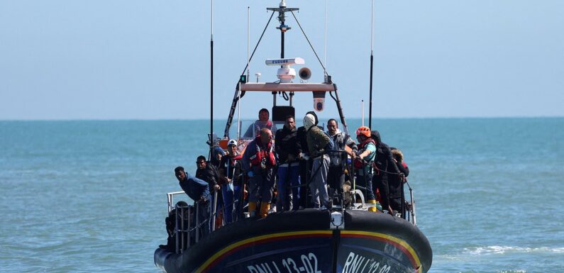Lifeboat lands migrants including very young children on Kent beach
