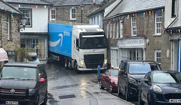 Moment Amazon driver gets wedged between Grade-II listed buildings