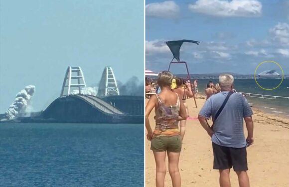 Moment Ukraine launches missile attack on Crimea Bridge in front of stunned holidaymakers just weeks after 'drone blast' | The Sun