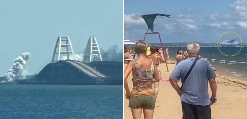 Moment Ukraine launches missile attack on Crimea Bridge in front of stunned holidaymakers just weeks after 'drone blast' | The Sun