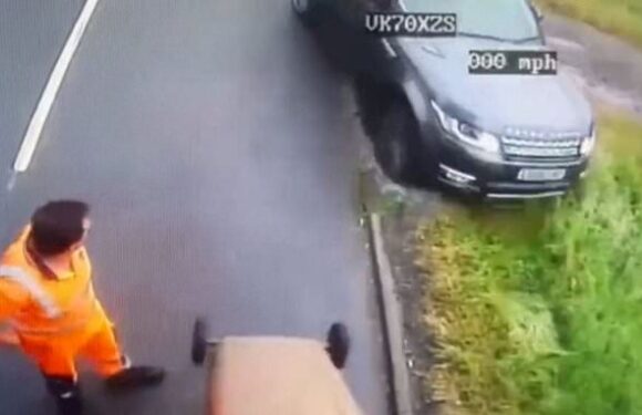 Moment impatient driver's attempt to overtake bin lorry backfires