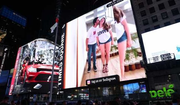 Polyamorous couple rents NYC BILLBOARD to promote 'free love'