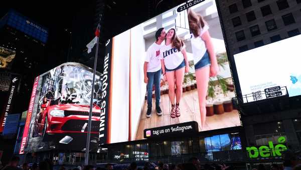 Polyamorous couple rents NYC BILLBOARD to promote 'free love'