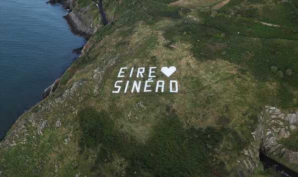 Sinéad O’Connor hillside tribute appears as family detail plans for last goodbye