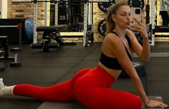 Strictly's Zara McDermott shows off her toned bum in very tight gym gear as she stretches during training | The Sun