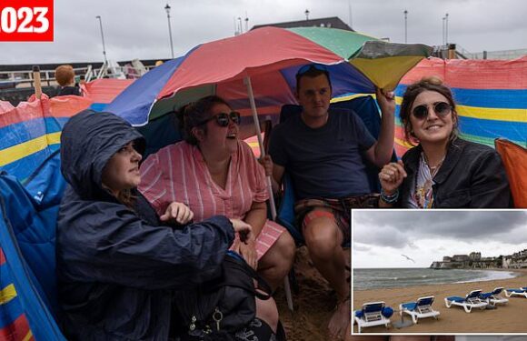 Sunseekers drenched by rain year on from record-breaking dry spell
