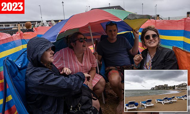 Sunseekers drenched by rain year on from record-breaking dry spell