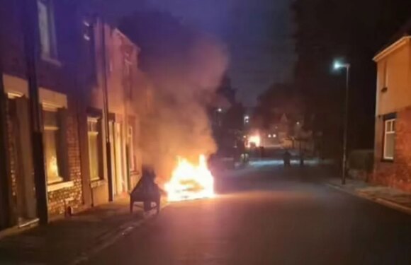 ‘Ten cars torched’ and homes evacuated as UK seaside town sees night of ‘chaos’