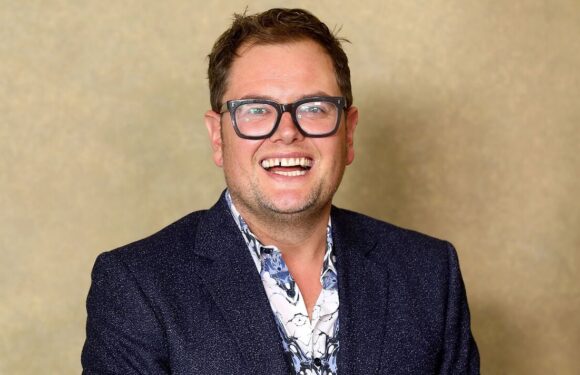 Alan Carr takes a cheeky swipe at Phillip Schofield while filming special