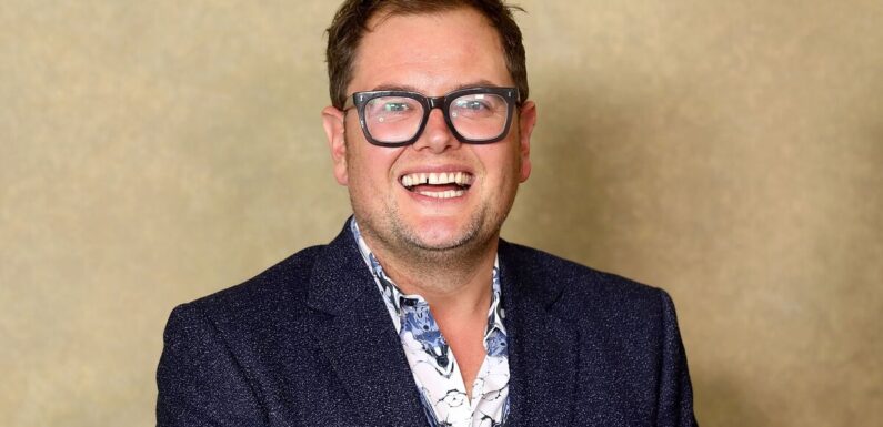 Alan Carr takes a cheeky swipe at Phillip Schofield while filming special