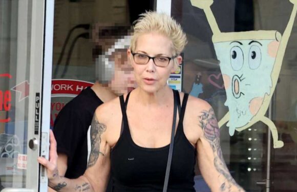 Eminem's ex-wife Kim Mathers' new tattoo collection explained from Alice In Wonderland pics to emo quotes on neck | The Sun