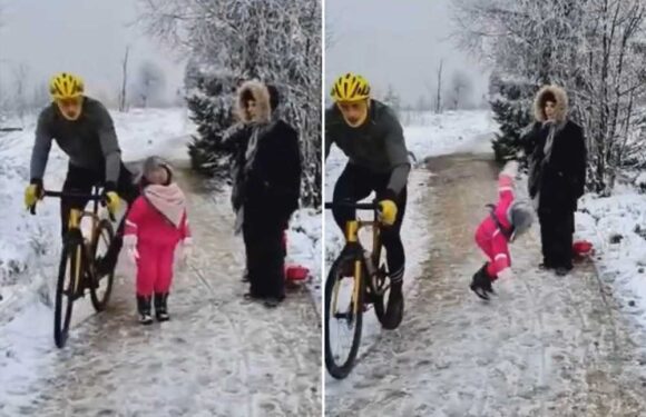 Infamous cyclist who kneed girl, 5, in back and knocked her into snow WINS lawsuit against her dad over viral video | The Sun