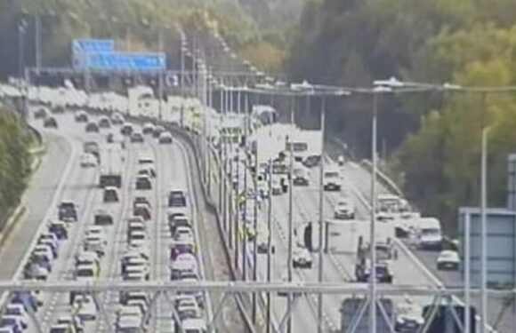 M25 accident: Lorry overturns in crash involving VW Passat and Ford Fiesta – as motorway suffers tailbacks | The Sun