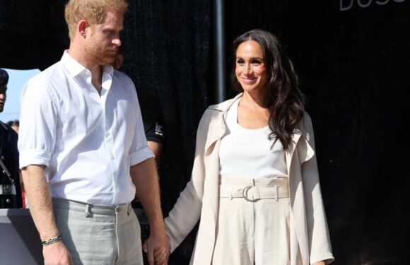 Meghan Markle and Prince Harry hold hands as they appear for last day of Invictus Games | The Sun