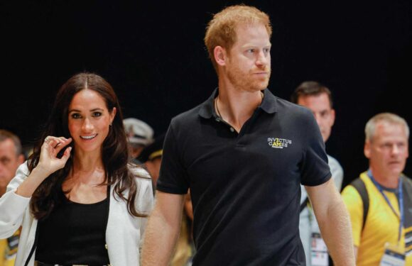 Meghan Markle is spotted without her engagement ring again as she laughs by Prince Harry's side in Germany | The Sun