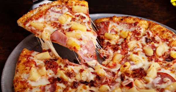 Pineapple on pizza ‘splitting nation apart’ as nearly 50% of Brits like topping