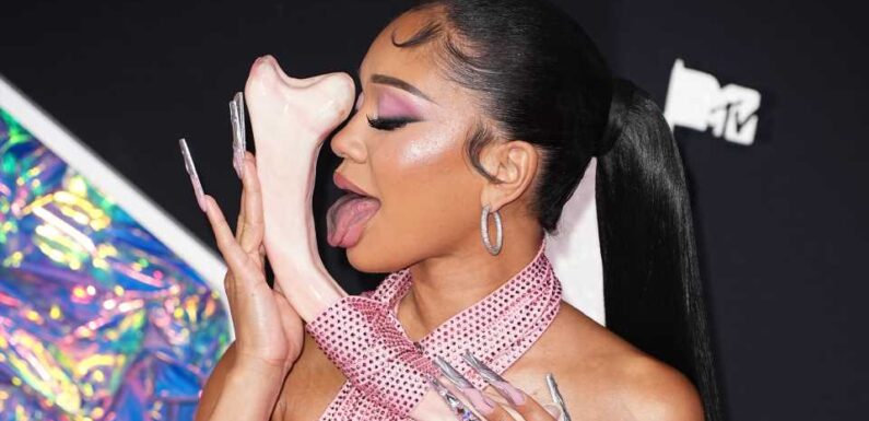 Saweetie botches her script in major blunder at MTV VMAs pre-show and fans are 'concerned' over her 'bizarre behavior' | The Sun