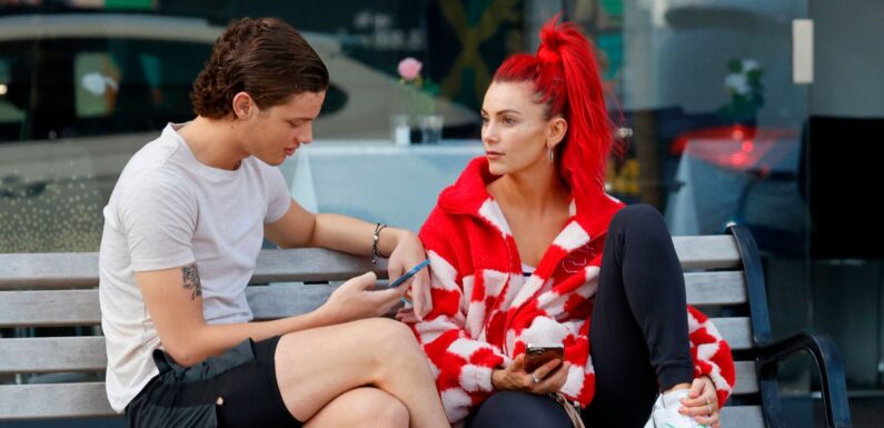 Strictly duo Bobby Brazier and Dianne Buswell look cosy as they walk arm in arm on playful day out