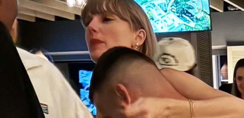 Taylor Swift cuddles up to new beau Travis Kelce