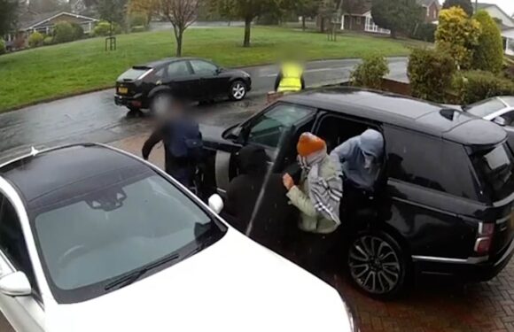 Terrifying moment armed gang smash their way into family home