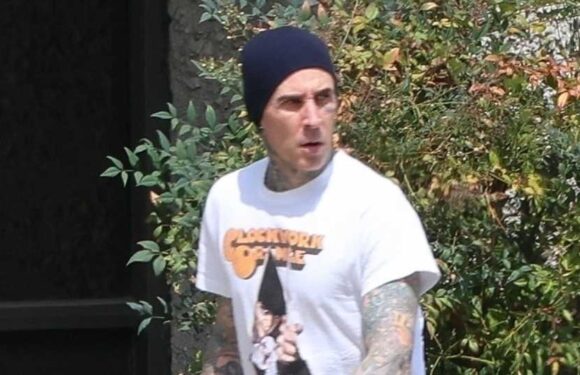 Travis Barker looks somber as he goes solo in LA without pregnant wife Kourtney Kardashian after 'medical emergency' | The Sun