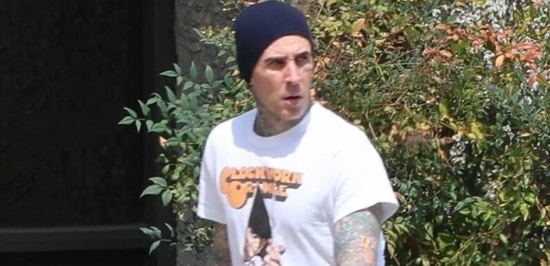 Travis Barker looks somber as he goes solo in LA without pregnant wife Kourtney Kardashian after 'medical emergency' | The Sun