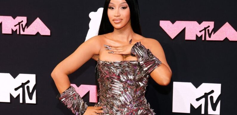 Cardi B goes topless on a plane to shows off ‘TikTok fix after outfit mishap