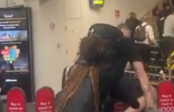 Commuters jump barriers to try and catch train as strikes spark chaos