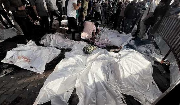 Doctors describe piles of dismembered bodies after Gaza hospital blast