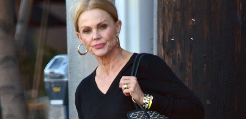 EXCLUSIVE: Belinda Carlisle looks unrecognizable, steps out with CANE