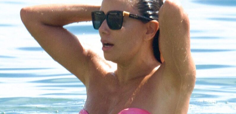 Eva Longoria looks incredible as she hits the beach in hot pink bikini