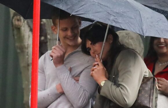 Freddie Brazier snuggles up to mystery brunette in rain as they support Bobby at Strictly Come Dancing