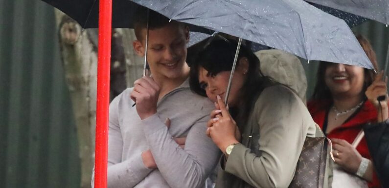 Freddie Brazier snuggles up to mystery brunette in rain as they support Bobby at Strictly Come Dancing