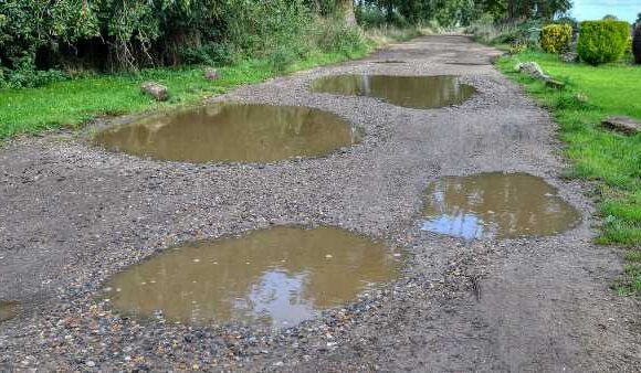 Furious villagers 'cut off' by potholes on their ancient Roman road