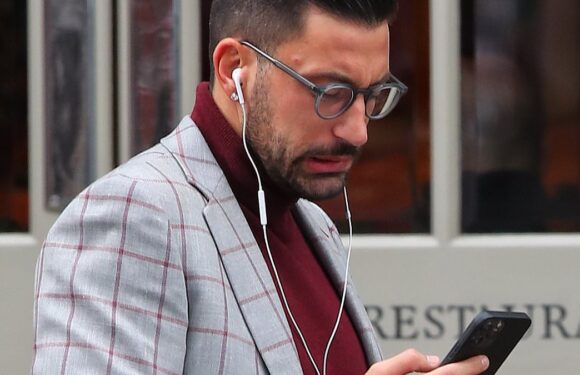 Giovanni Pernice is glued to his phone after Amanda quit Strictly