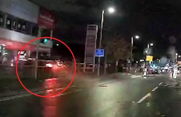 Horror moment car speeds through junction and smashes into a building