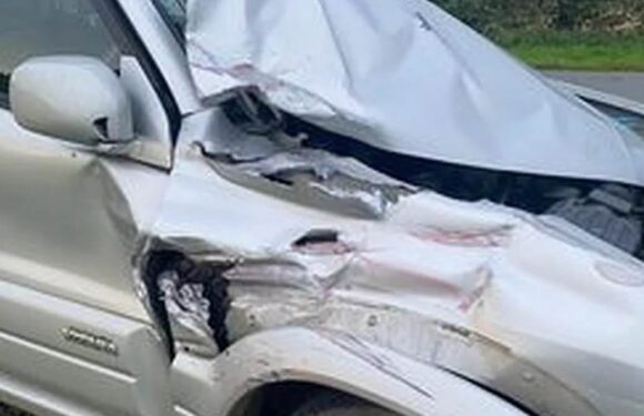 Moment tractor smashes into two parked cars outside woman's house